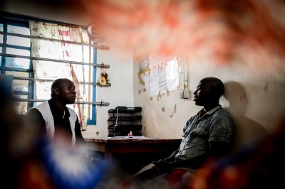 Counsellor Floribert Nzaituriki Nabonibo, conducts a psychosocial consultation with psychiatric patient Fabien Banjanga, at Mweso General Hospital on the border between the Masisi and Rutshuru territories in North Kivu, Democratic Republic of the Congo. Photo: Sara Creta/MSF
